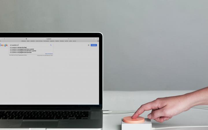 Photo of »Object C – Leaving fault traces« of the work »Accessories for the Paranoid«,  a laptop with Google search engine tab open is connected with a big red button.