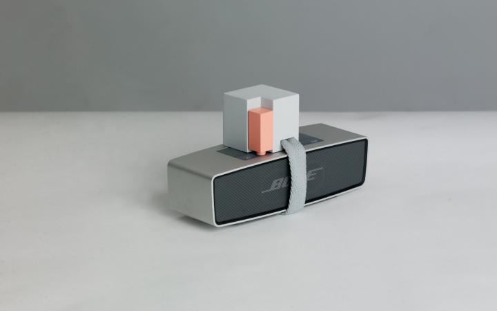 Photo of »Object D – Blurring use patterns« of the work »Accessories for the Paranoid«, a music loudspeaker is provided with an apparatus.