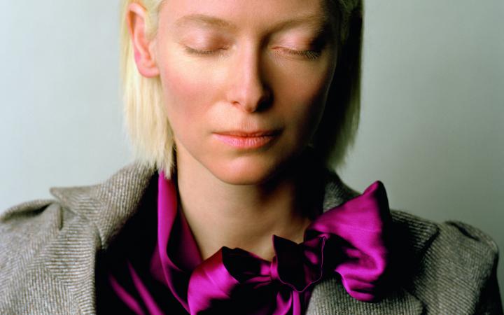 A woman, Tilda Swinton, with her eyes closed.