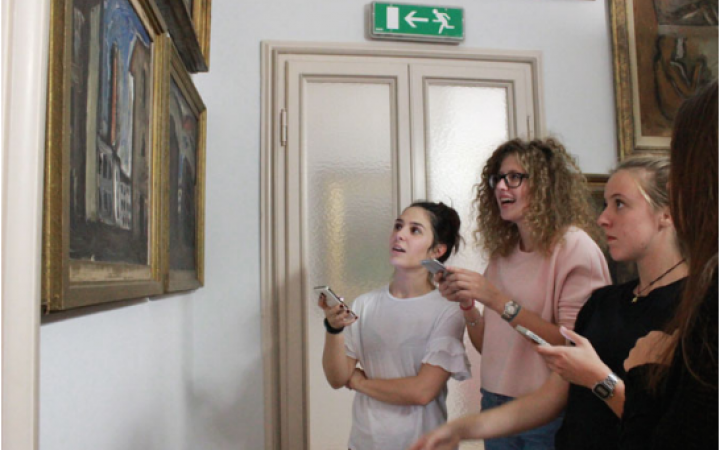 Museum visitors use their mobile phones to play the chat game of the Case Museo di Milano