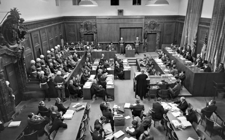 Black and white picture of many people in a courtroom