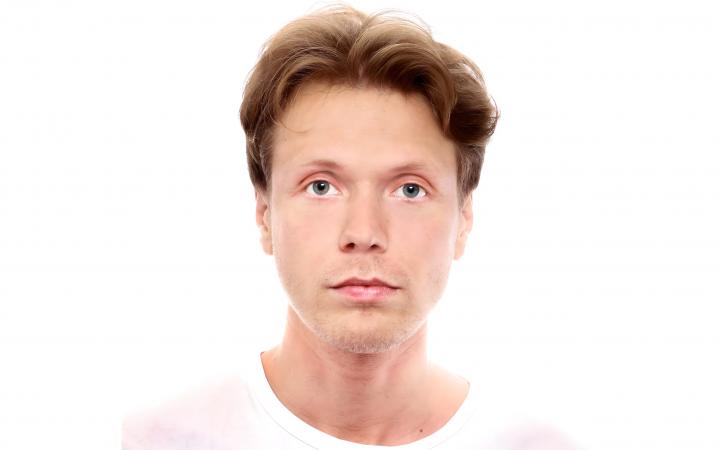The portrait shows Russian artist Vasiliy Sumin in white T-shirt.