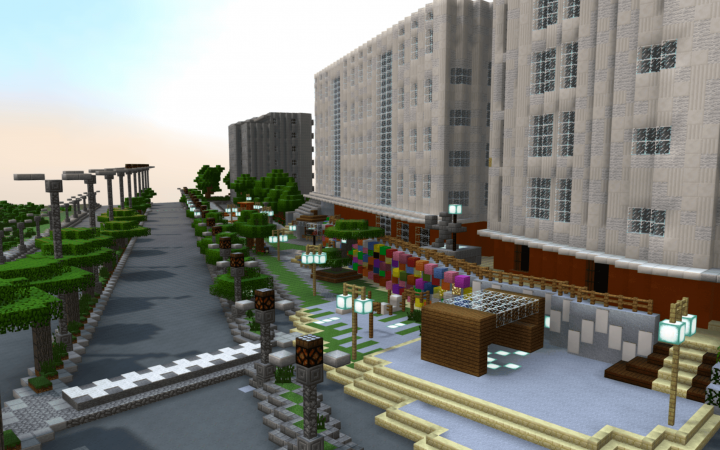 3D model of an urban space in the game Minecraft. House facades are illustrated in the right-hand part of the image. A street is located in the center of the image. Green and colorful plants are shown between these two parts of the image.
