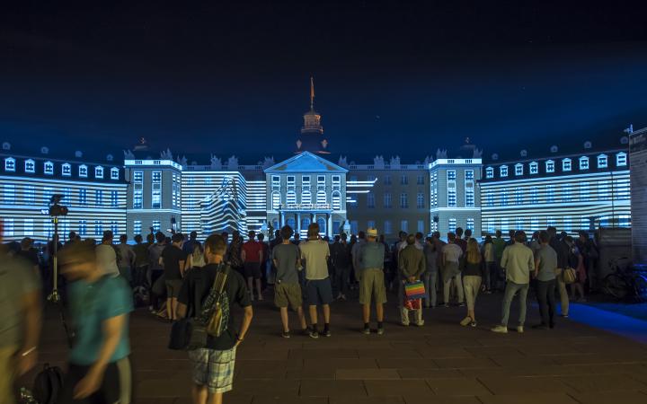 The Karlsruhe Palace is bathed in blue light