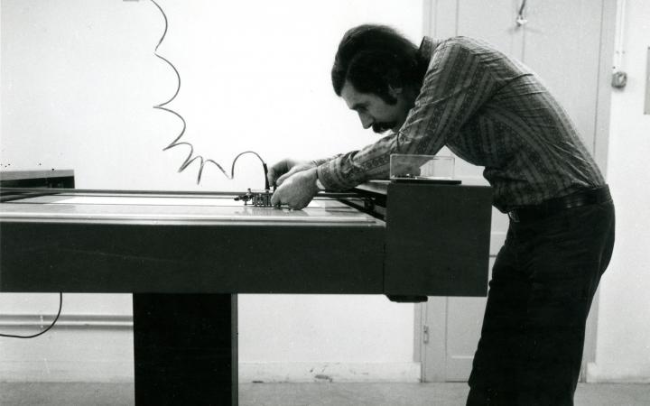 Manfred Mohr sets up a Benson plotter in Centre de Calcul de la Météorologie Nationale, 1971
