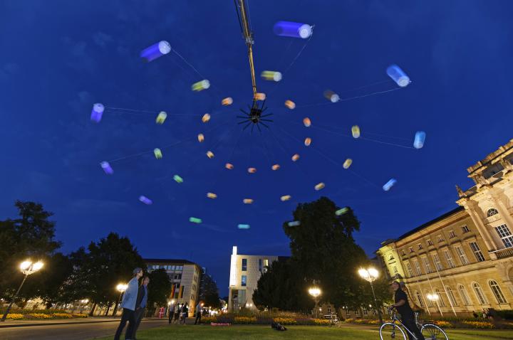 A huge colored centrifugal in Karlsruhe night sky