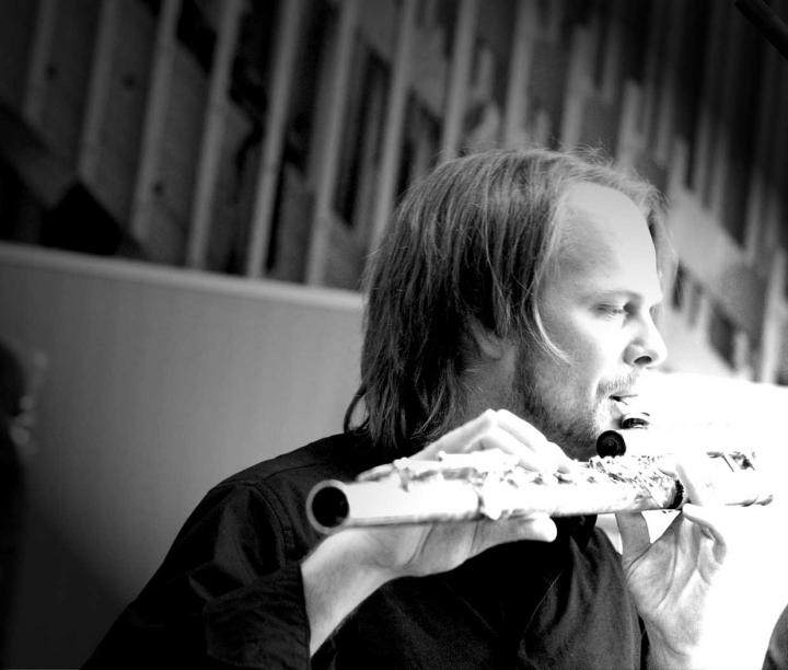 A man plays transverse flute