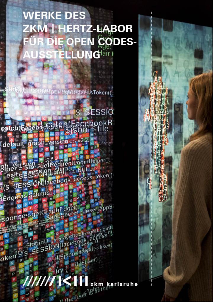 Eine Frau steht vor dem Kunstwerk YOU:R:CODE bestehend aus großen Bildschirmen