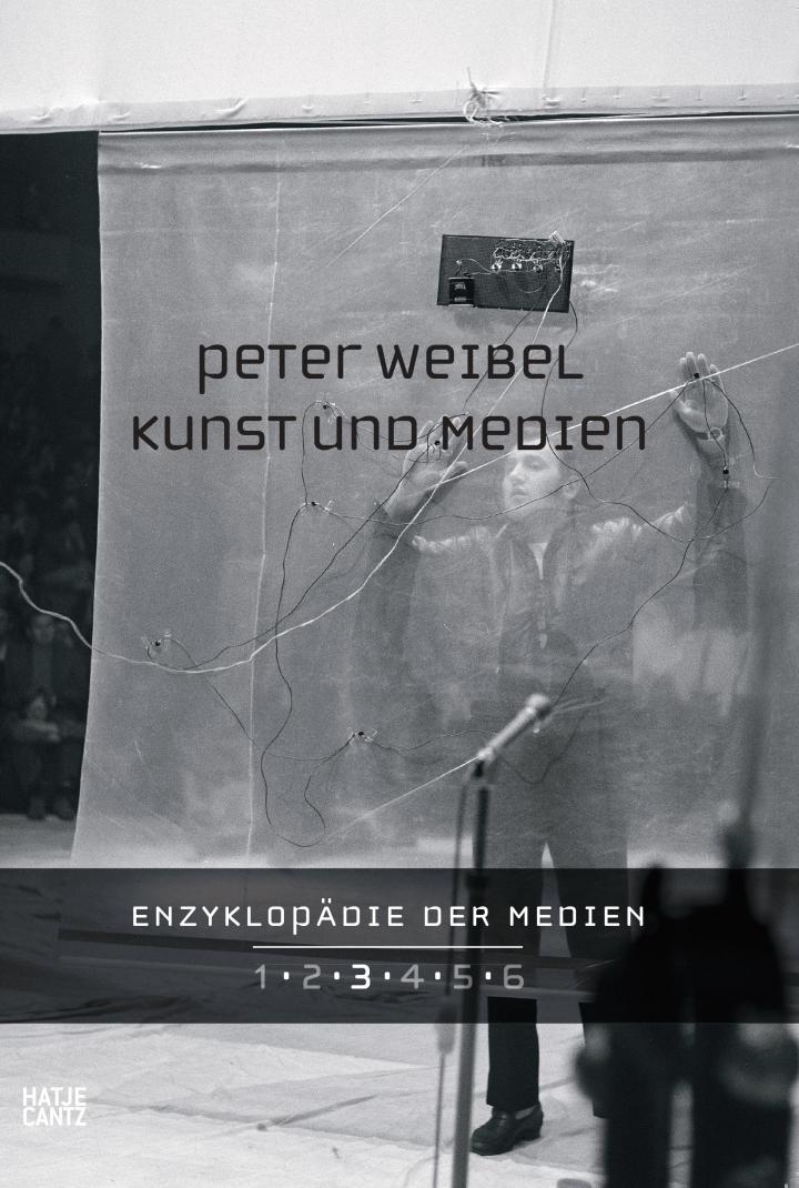 Publication cover: light grey and person with raised arms in the background