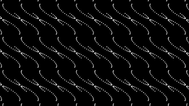 An arrangement of white dots in a wave-like structure on a black background