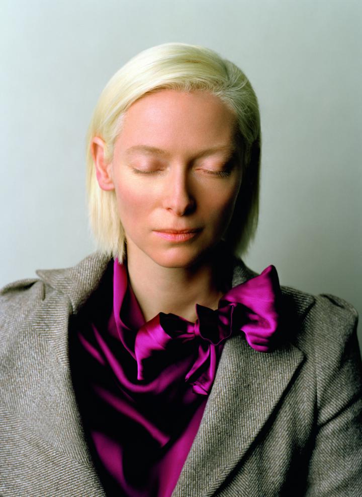 A woman, Tilda Swinton, with her eyes closed.