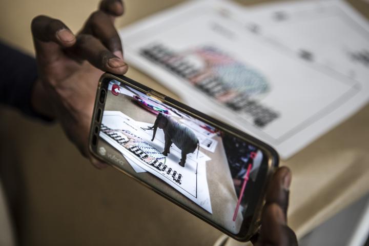 On a mobile phone display an elephant appears in Augmented Reality