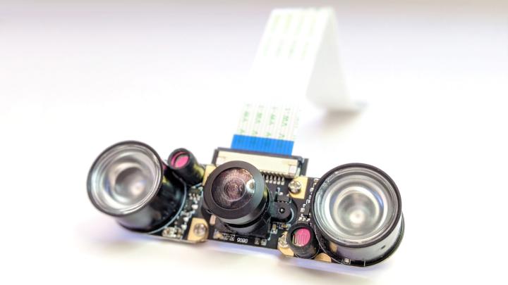 Photo of a circuit board with optical lenses and a cable – the eyes of the robot ODO