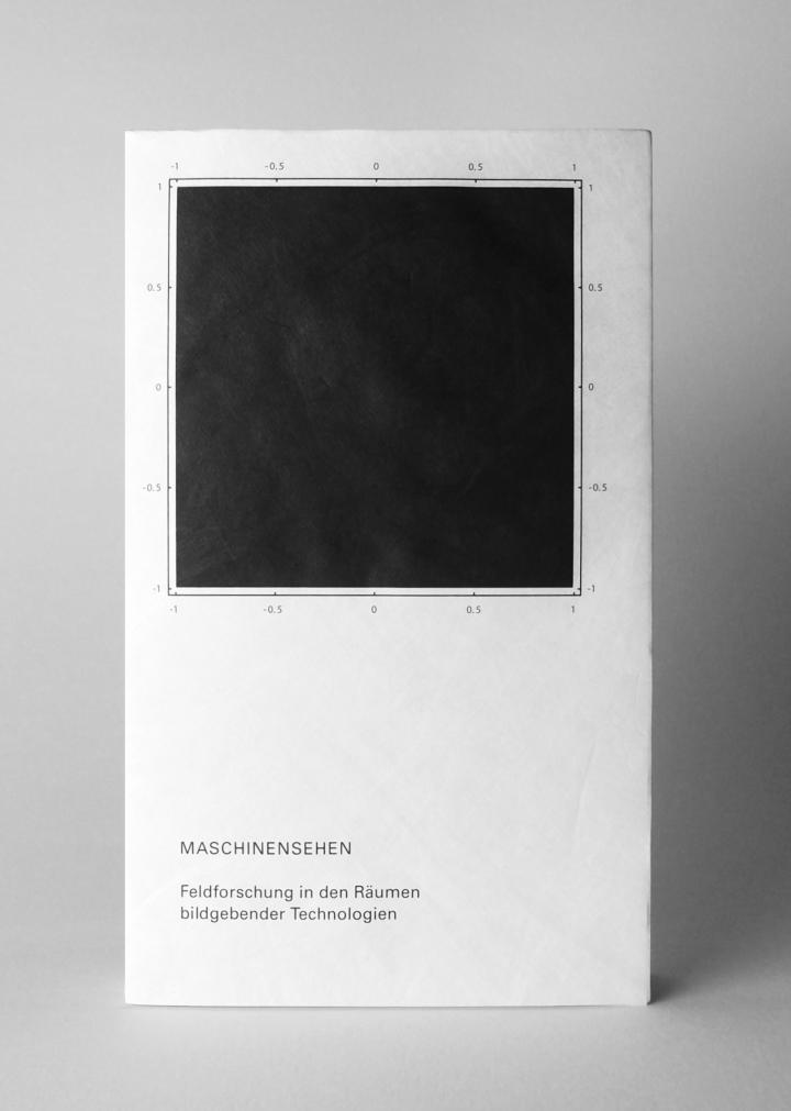 A black book cover with a black title and a black square