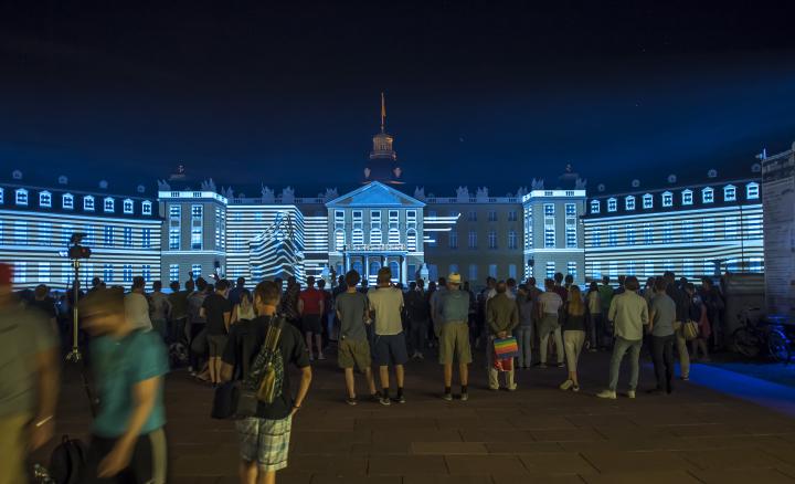 The Karlsruhe Palace is bathed in blue light