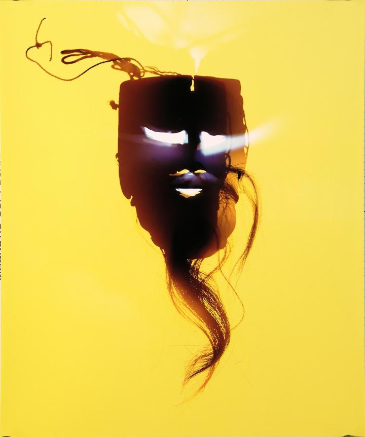 Mask against a yellow background