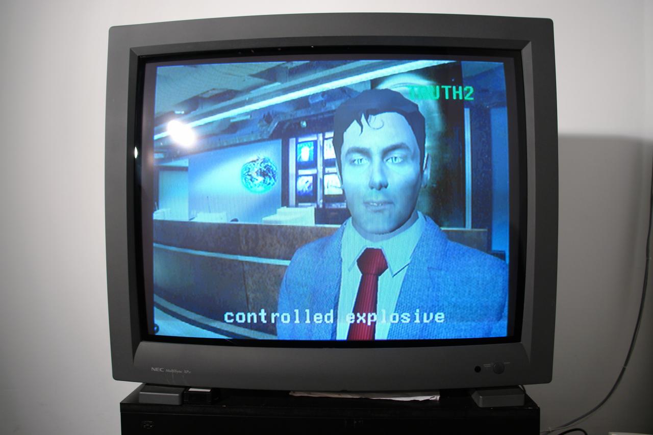Fernsehbildschirm mit einem copmuteranimierten Mann in einem Anzug