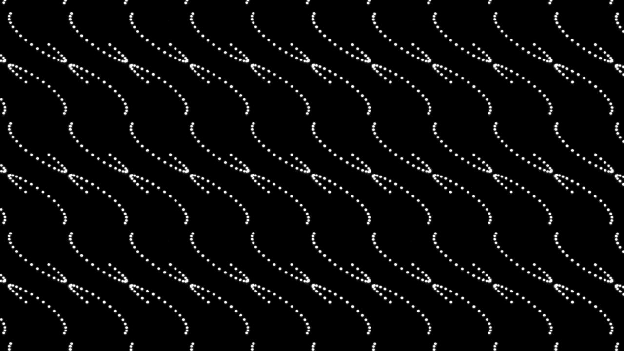 An arrangement of white dots in a wave-like structure on a black background