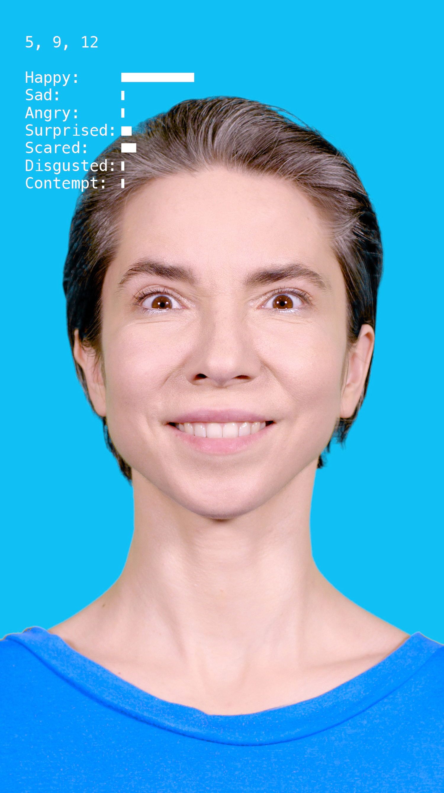 The screenshot shows a woman laughing frontally into the camera.