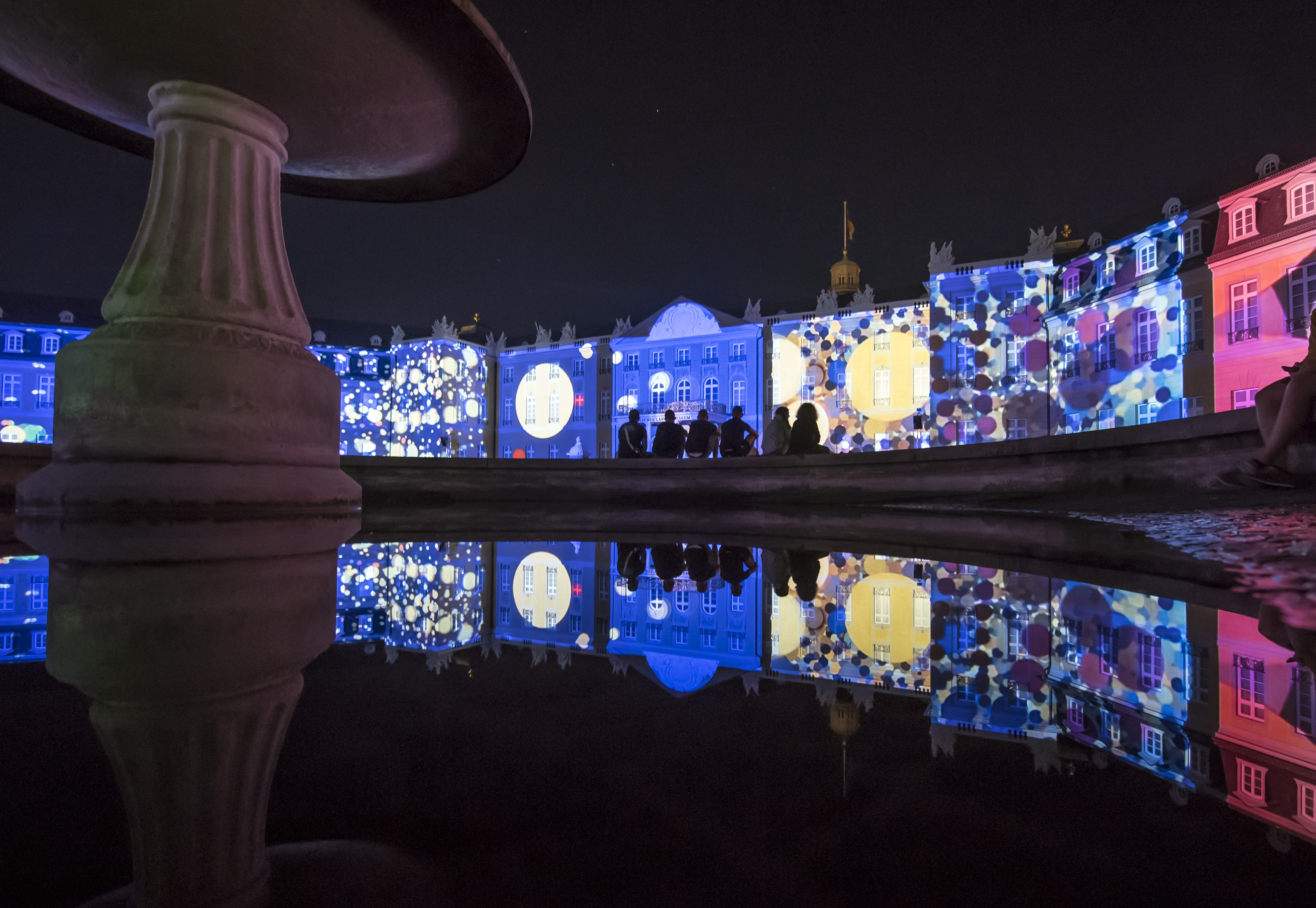 The Karlsruhe Palace is bathed in colorful light
