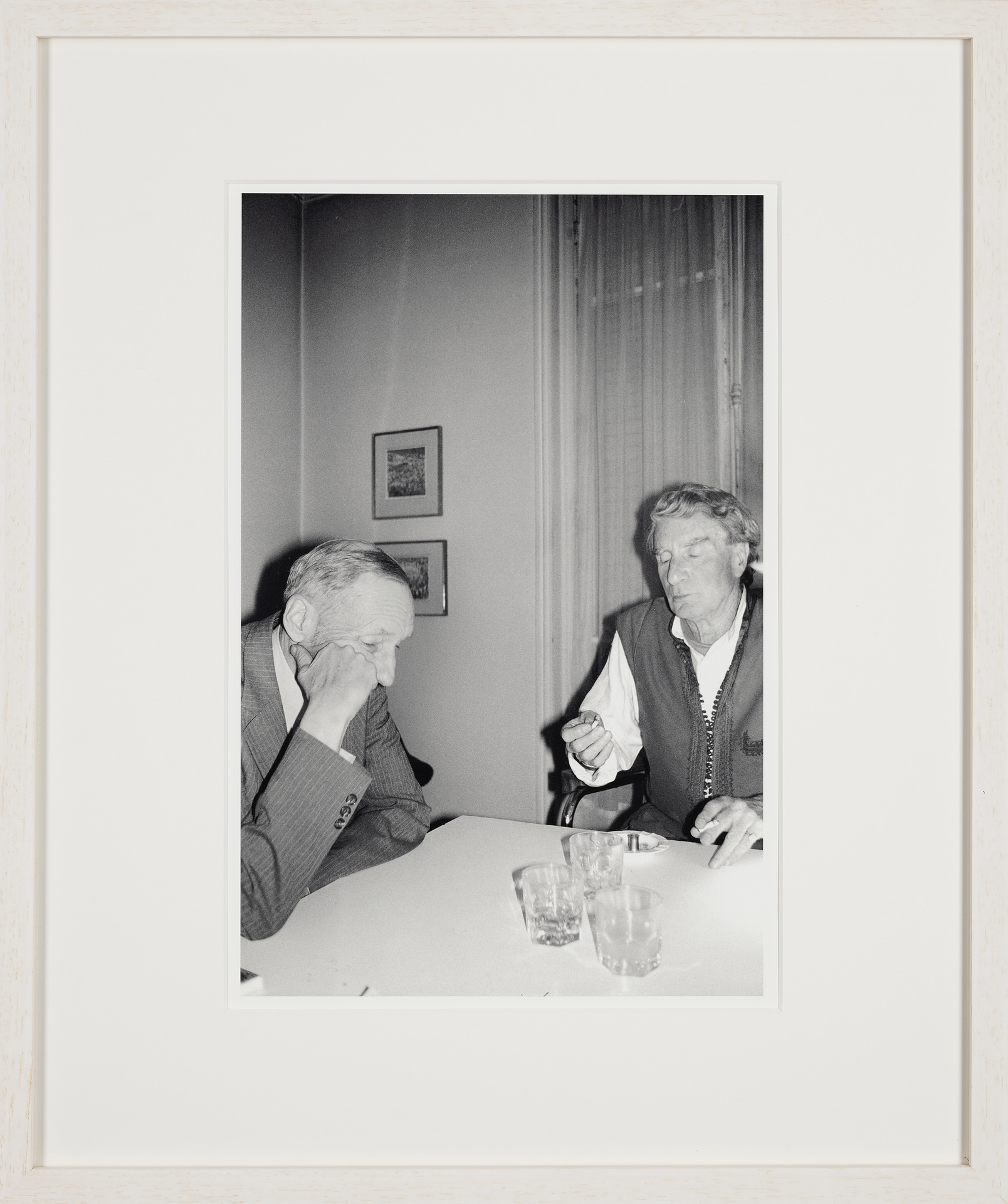 William Burroughs and Brion Gysin after dinner, with empty plates cleared away, or maybe before dinner, with empty whiskeys and a slim spliff passed around