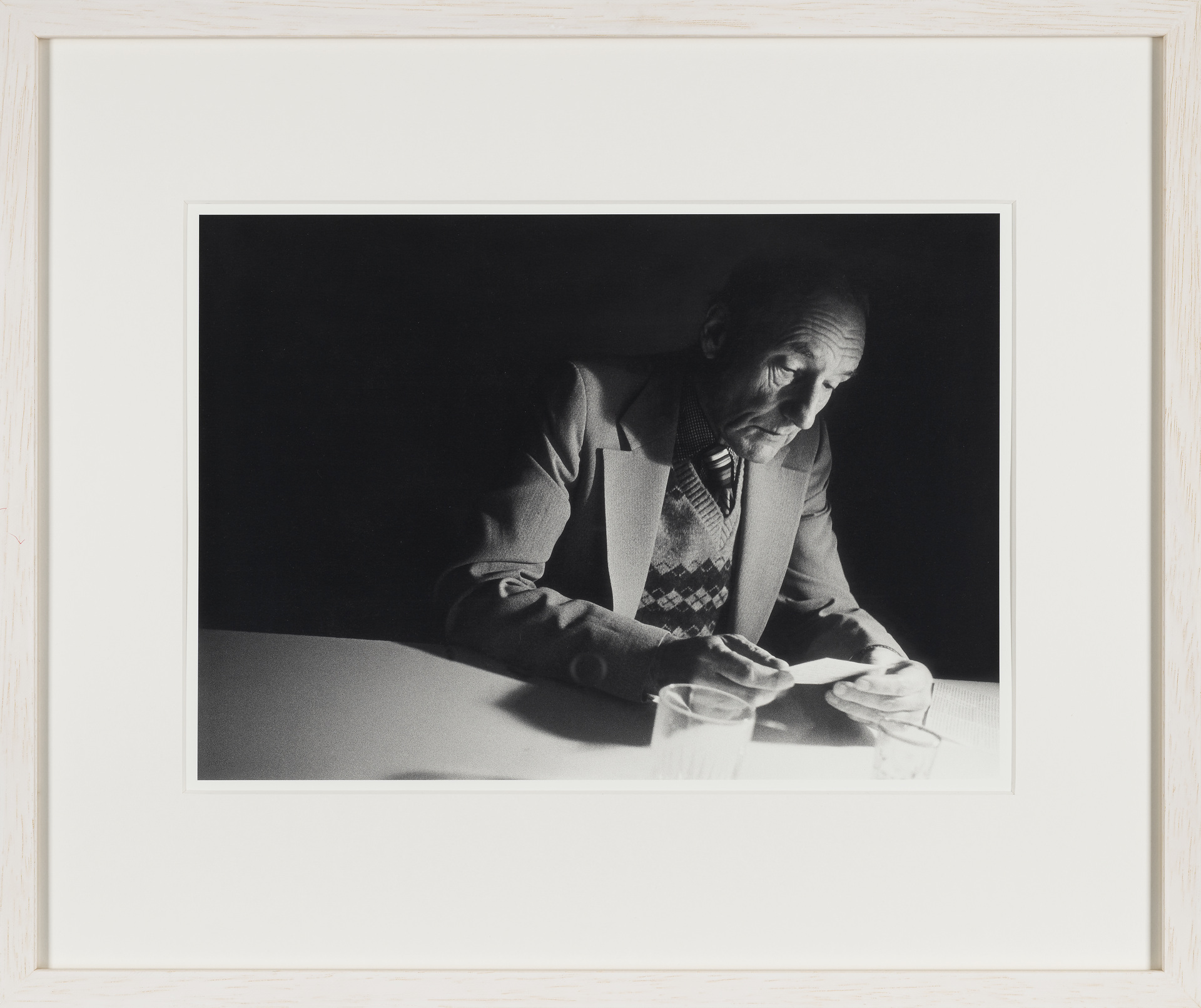 William Burroughs looking at a photograph at Brion Gysin’s Paris flat, shortly after their participation in the ten days One World Poetry Festival in Amsterdam, in October 1979