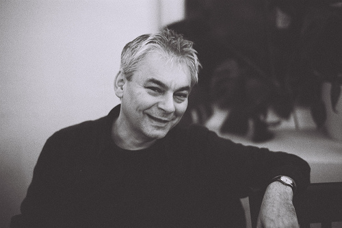 Black and white photo of a seated man