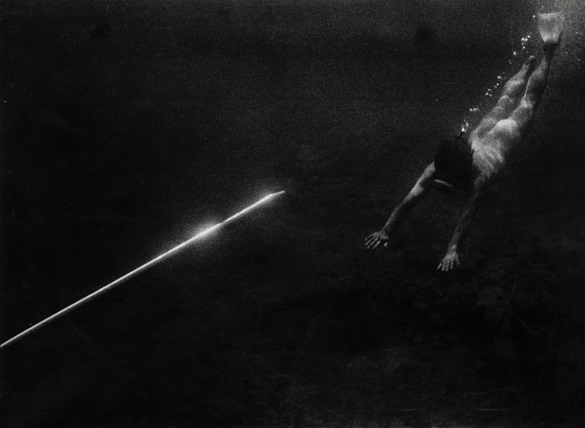 Taucher mit Lichtstab