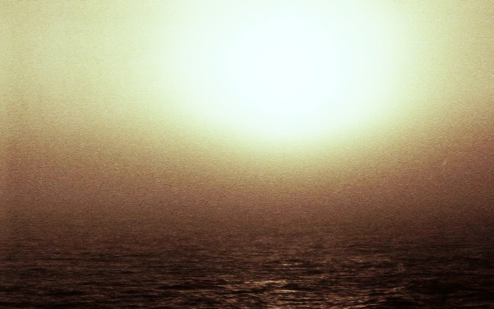 Glimmering sun over the sea.