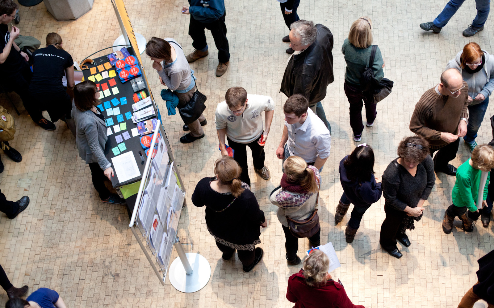 People standing in front of a stand