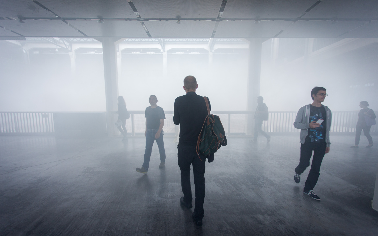 Several people walking through the Cloud in the ZKM 