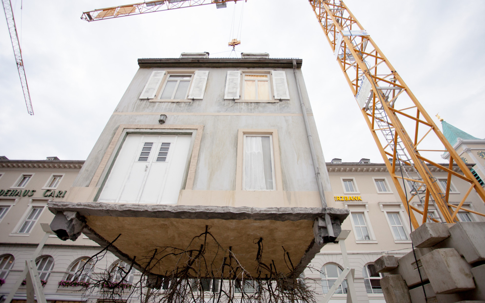 A House hangs on a crane