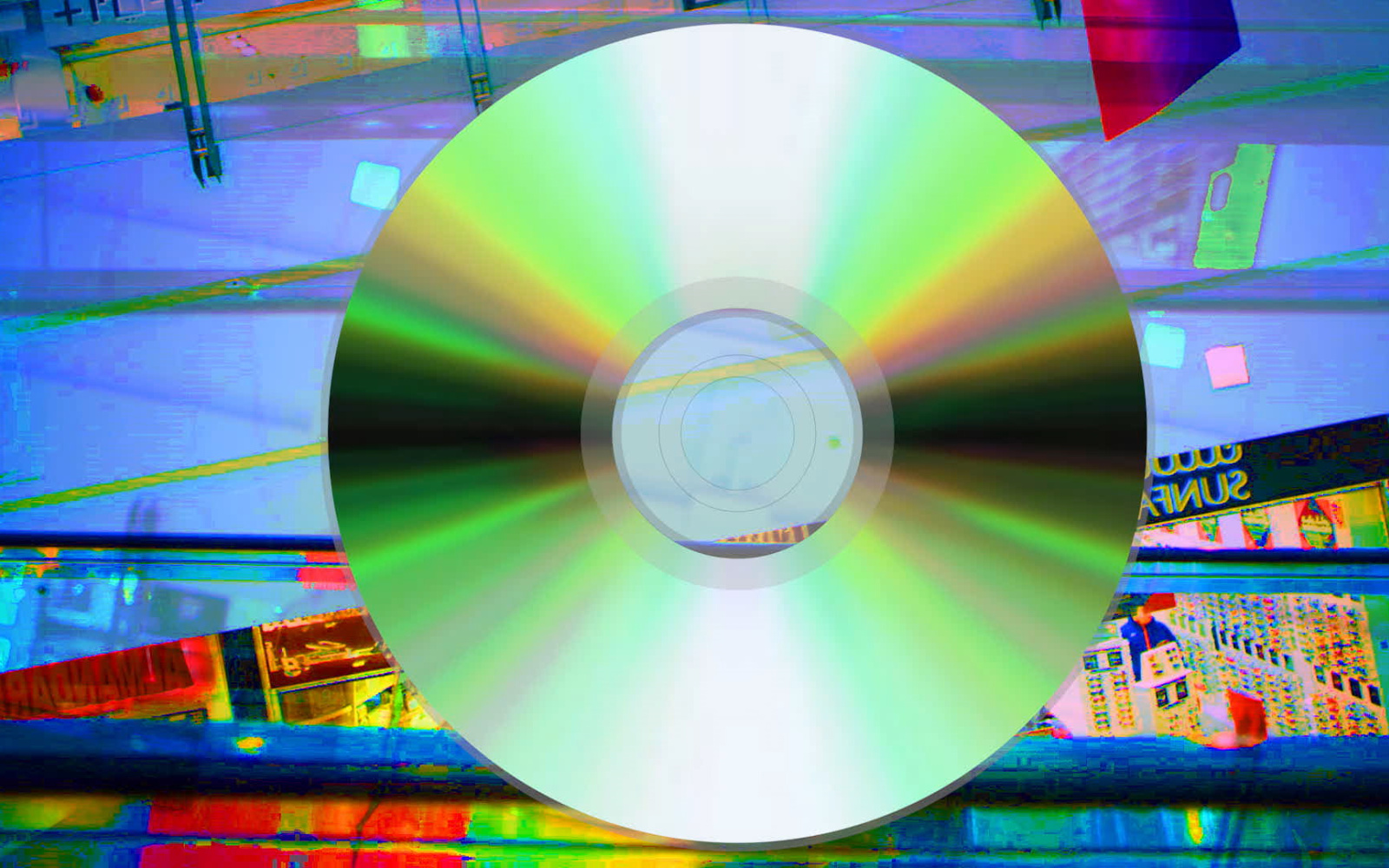 A CD in front of a colored backround