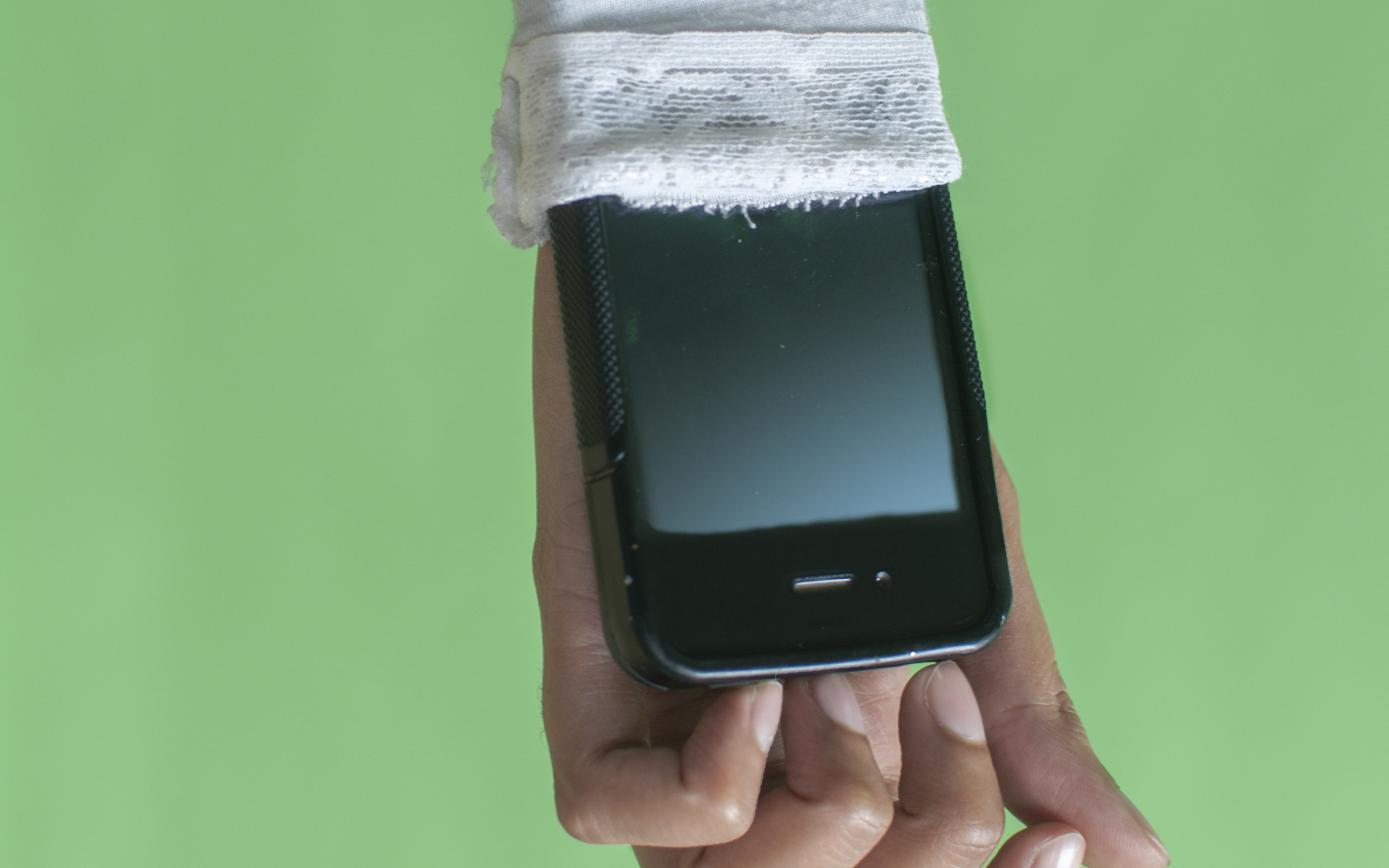 Forearm with smartphone put in the sleeve