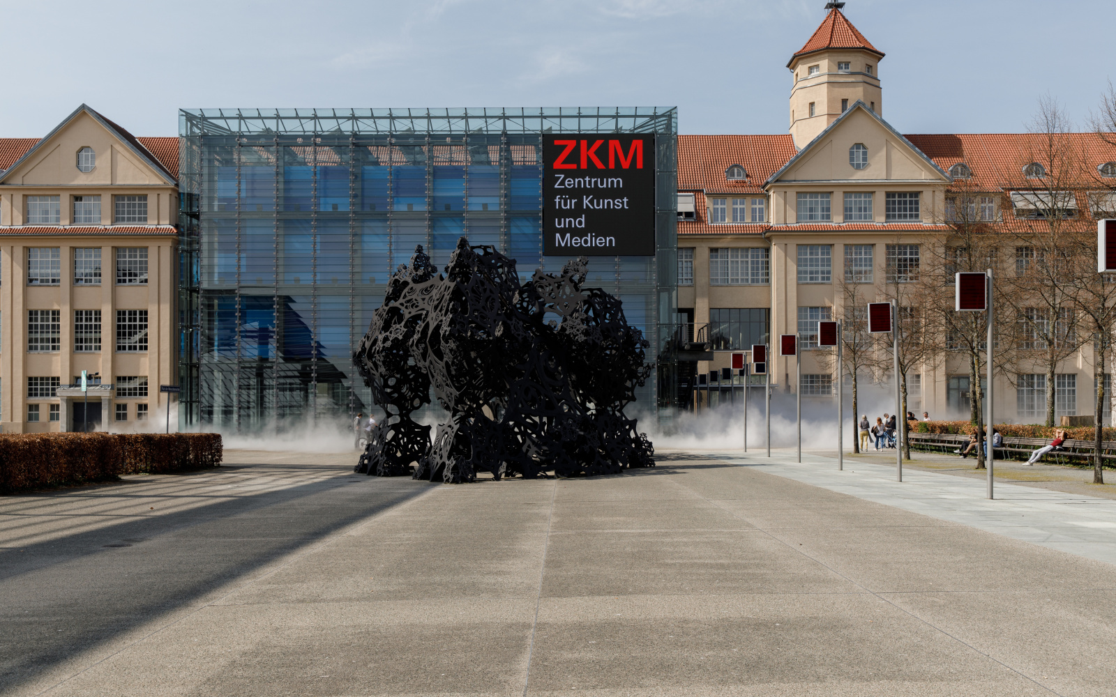 Fog rises around the cube of the ZKM, which influences the view of the ZKM.