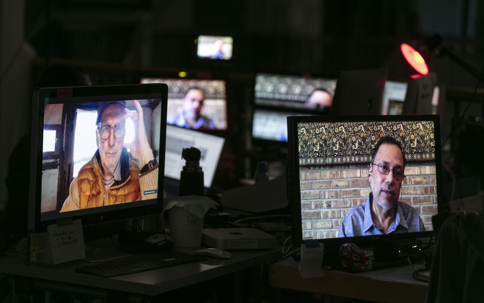 Multiple Mini-Displays show the faces of Bruno Latour and Dipesh Chakrabarty.