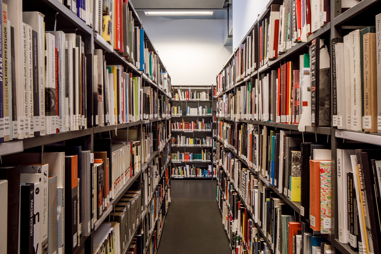 You can see many shelves filled with books.