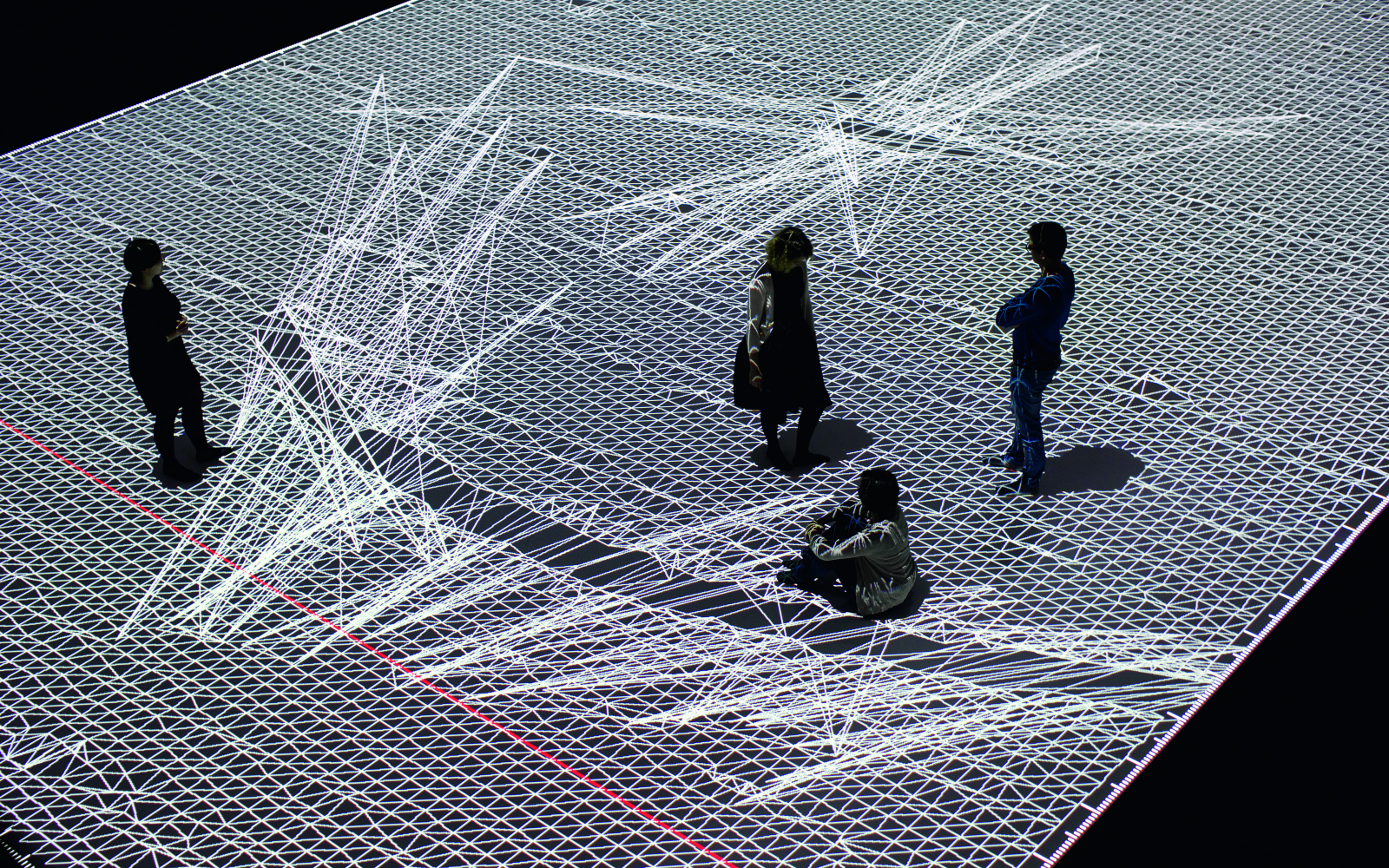 People standing on a white projection