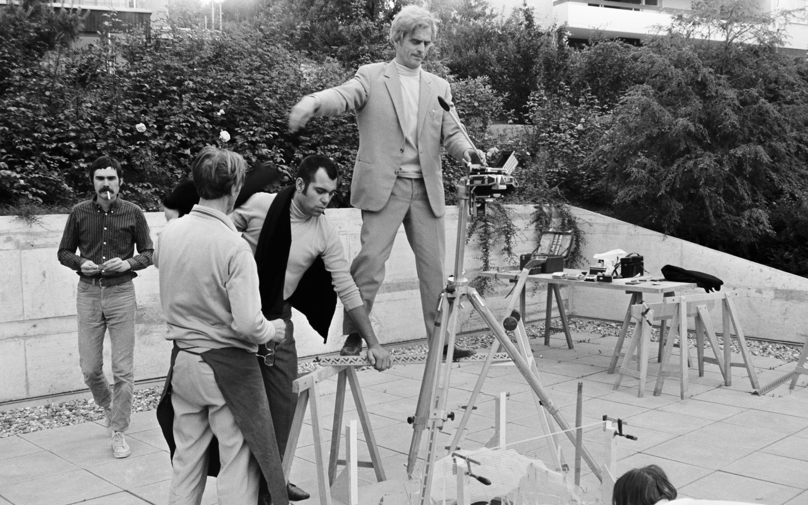 Frei Otto photographing the model of the roofing of the temporary tribune of the Olympiahalle in Munich