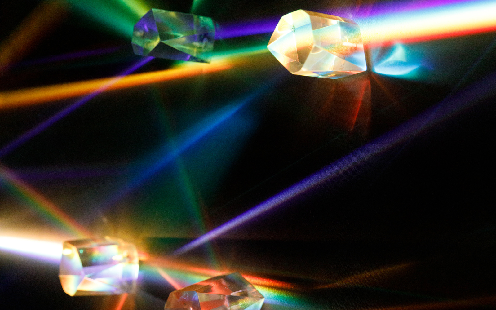 Prisms scatter light into small rainbows