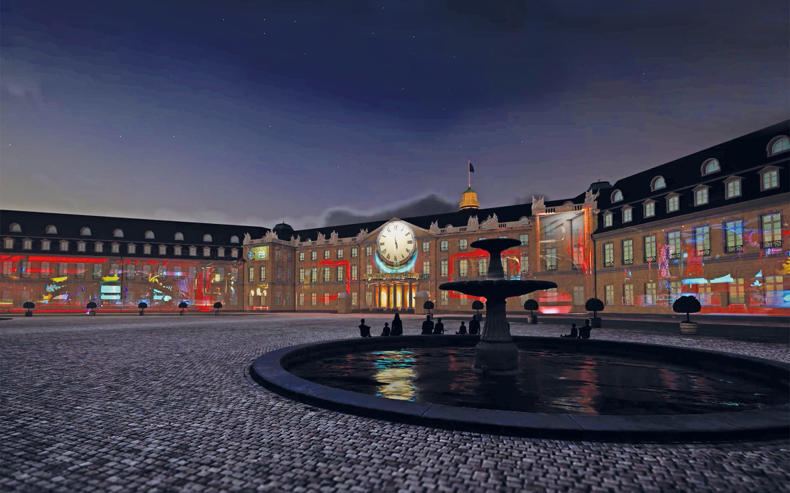 Ein virtuelles Bild des Karlsruher Schlosses, davor der Brunnen, es ist Abend, eine große Uhr ist auf das Schloss projiziert und es ist symmetrisch mit Farbenlinien beleuchtet.