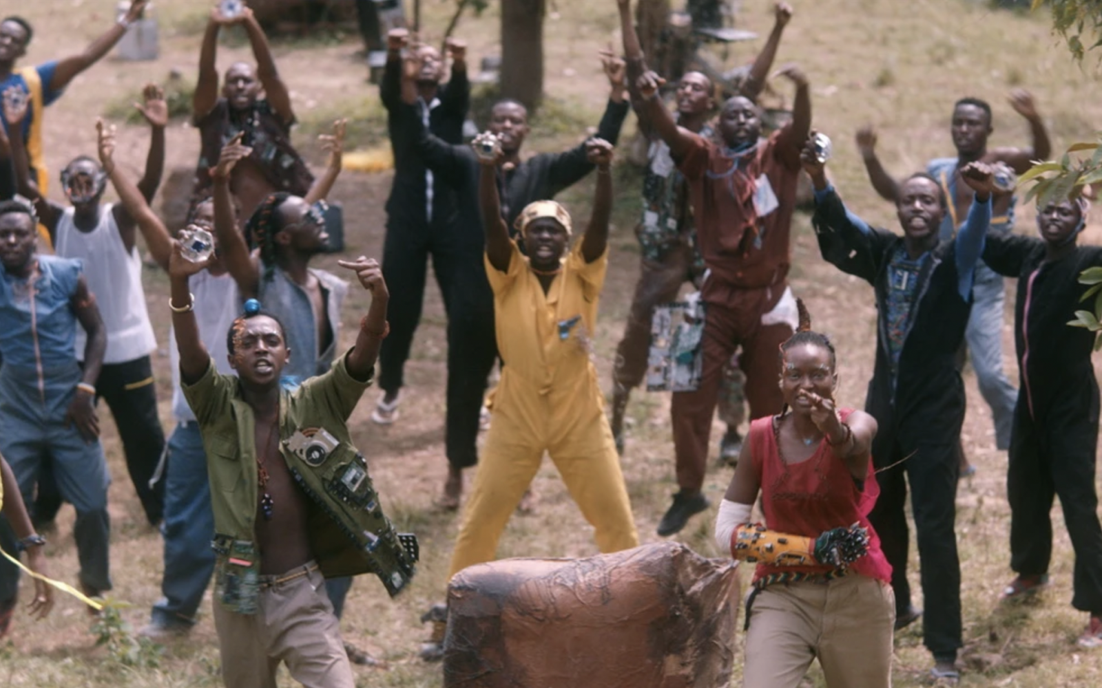 A group of black people give the camera the middle finger.