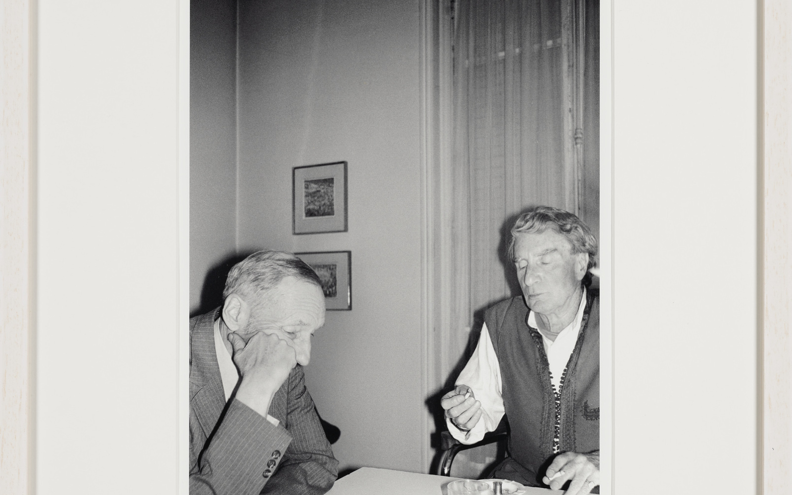 William Burroughs and Brion Gysin after dinner, with empty plates cleared away, or maybe before dinner, with empty whiskeys and a slim spliff passed around