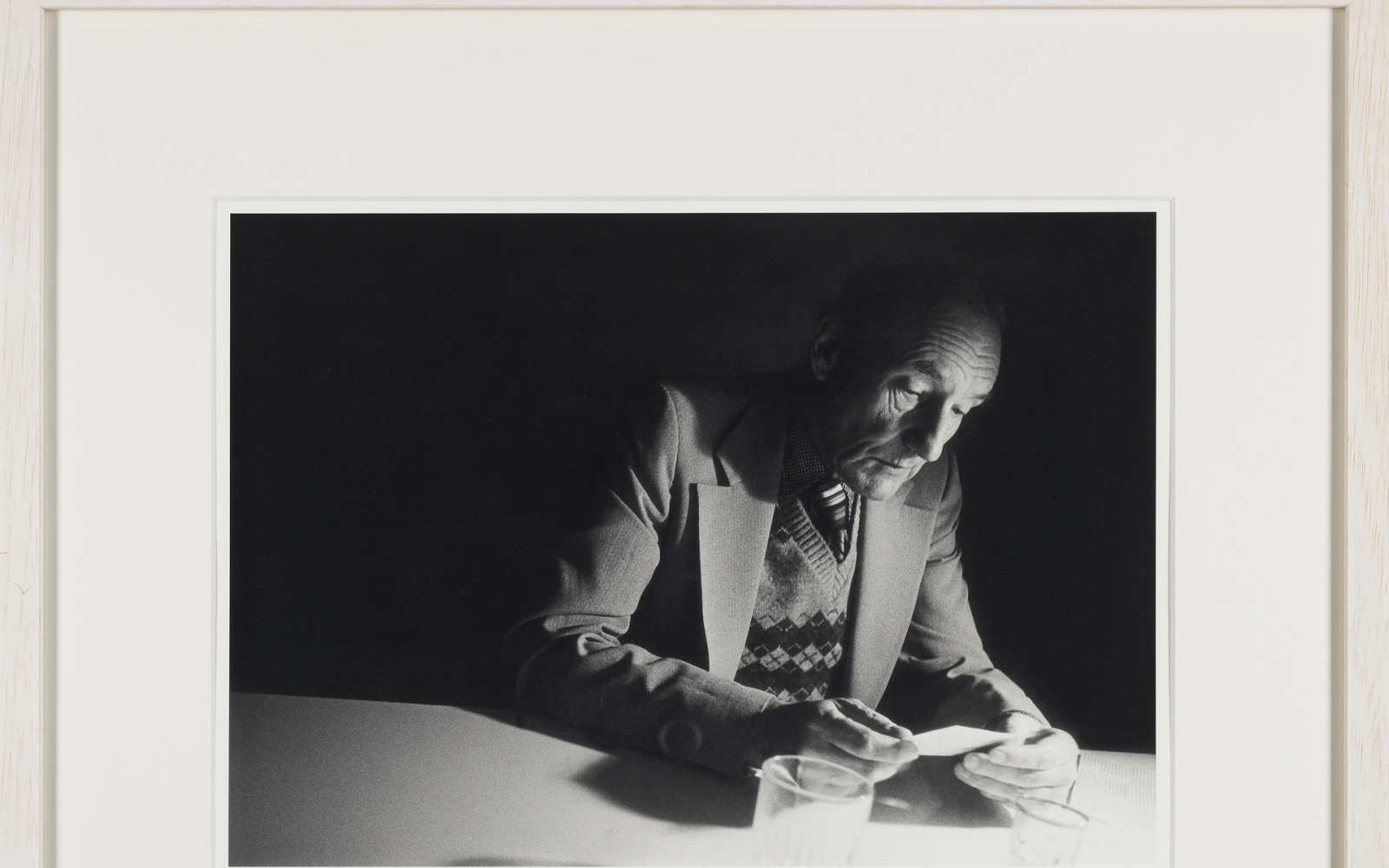 William Burroughs looking at a photograph at Brion Gysin’s Paris flat, shortly after their participation in the ten days One World Poetry Festival in Amsterdam, in October 1979