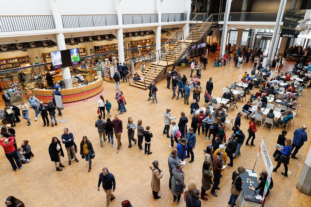 The ZKM foyer atrium filled with many people