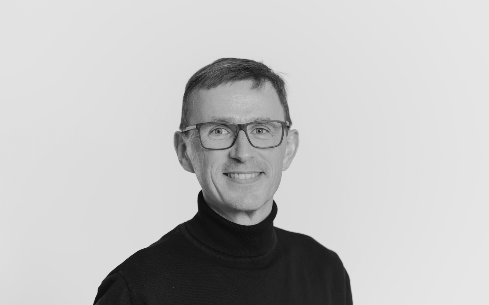 Zu sehen ist das Portraitfoto einer Person. 