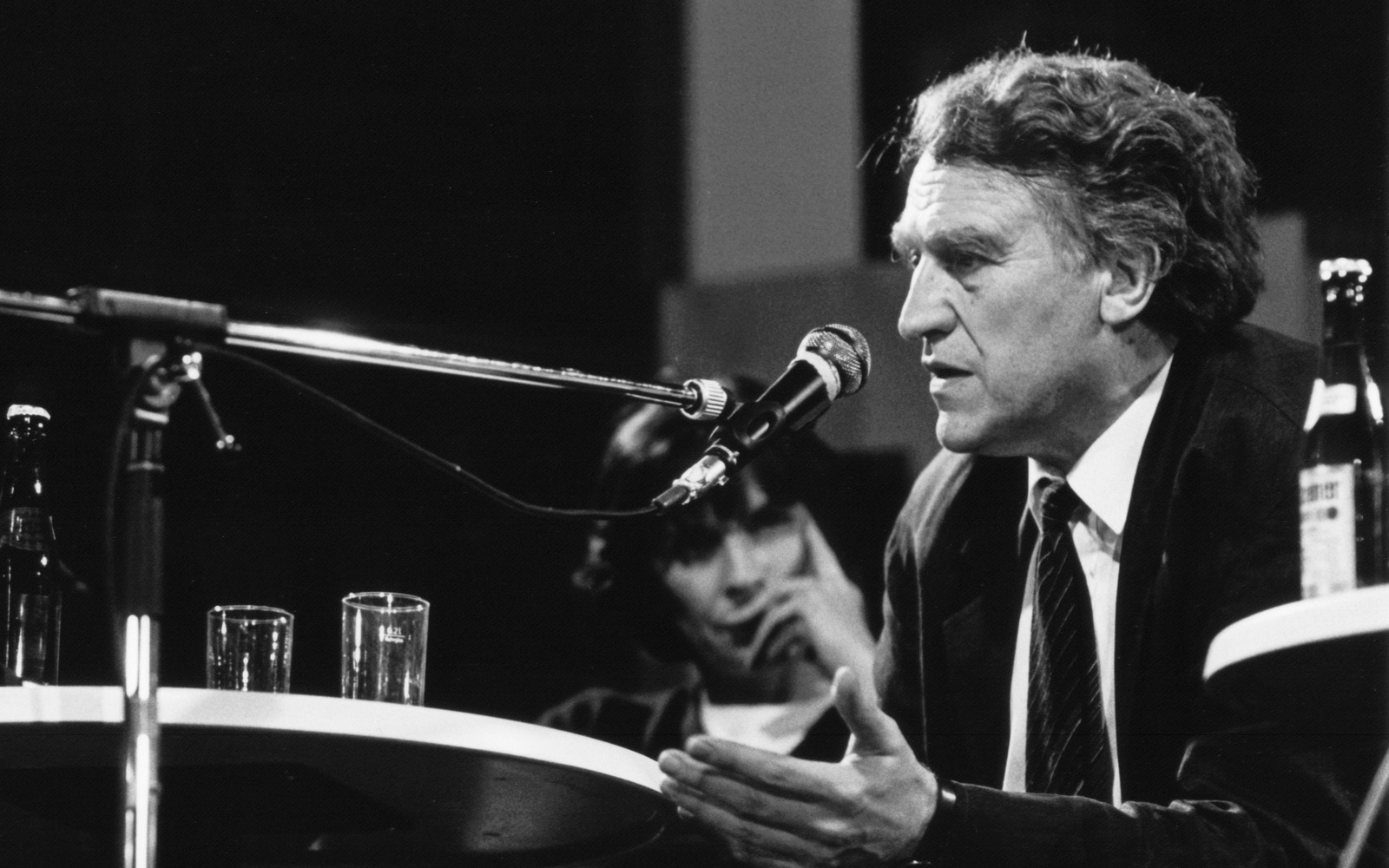 Black and white photo of Heinrich Klotz on a stage