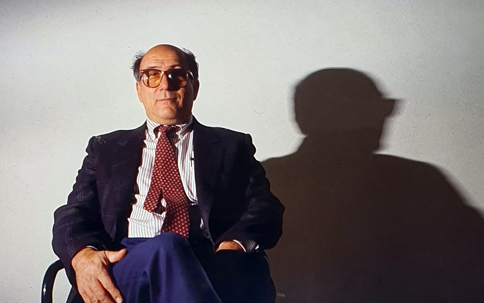 Portrait of a person in front of a white background.