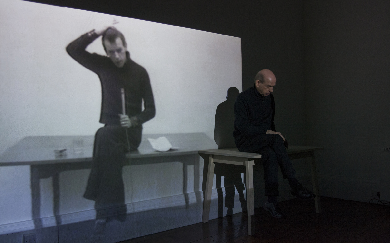 A man sitting on a stage