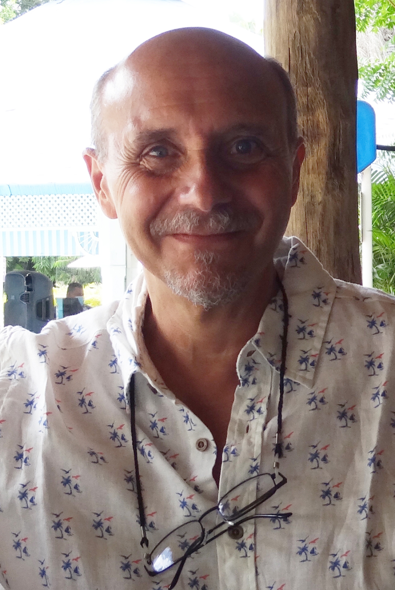 You can see a portrait photo of a person wearing a printed shirt.  